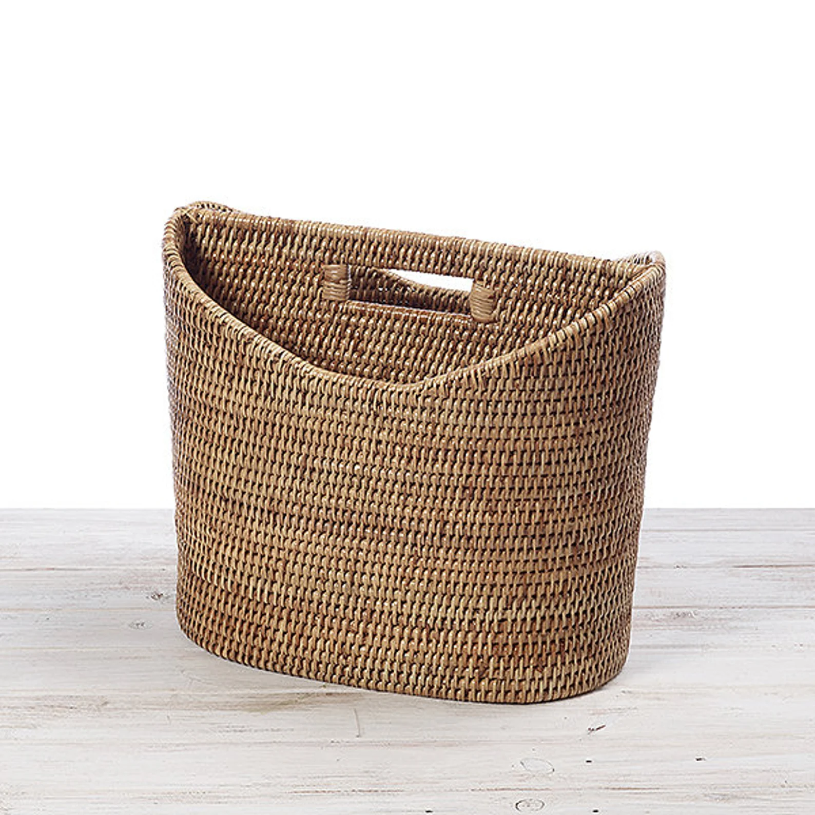 Artisan handweaving rattan in traditional patterns